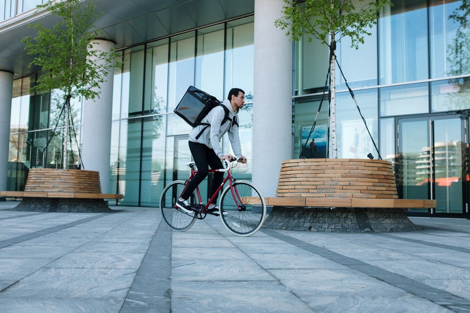 Bicycle courier riding through the city