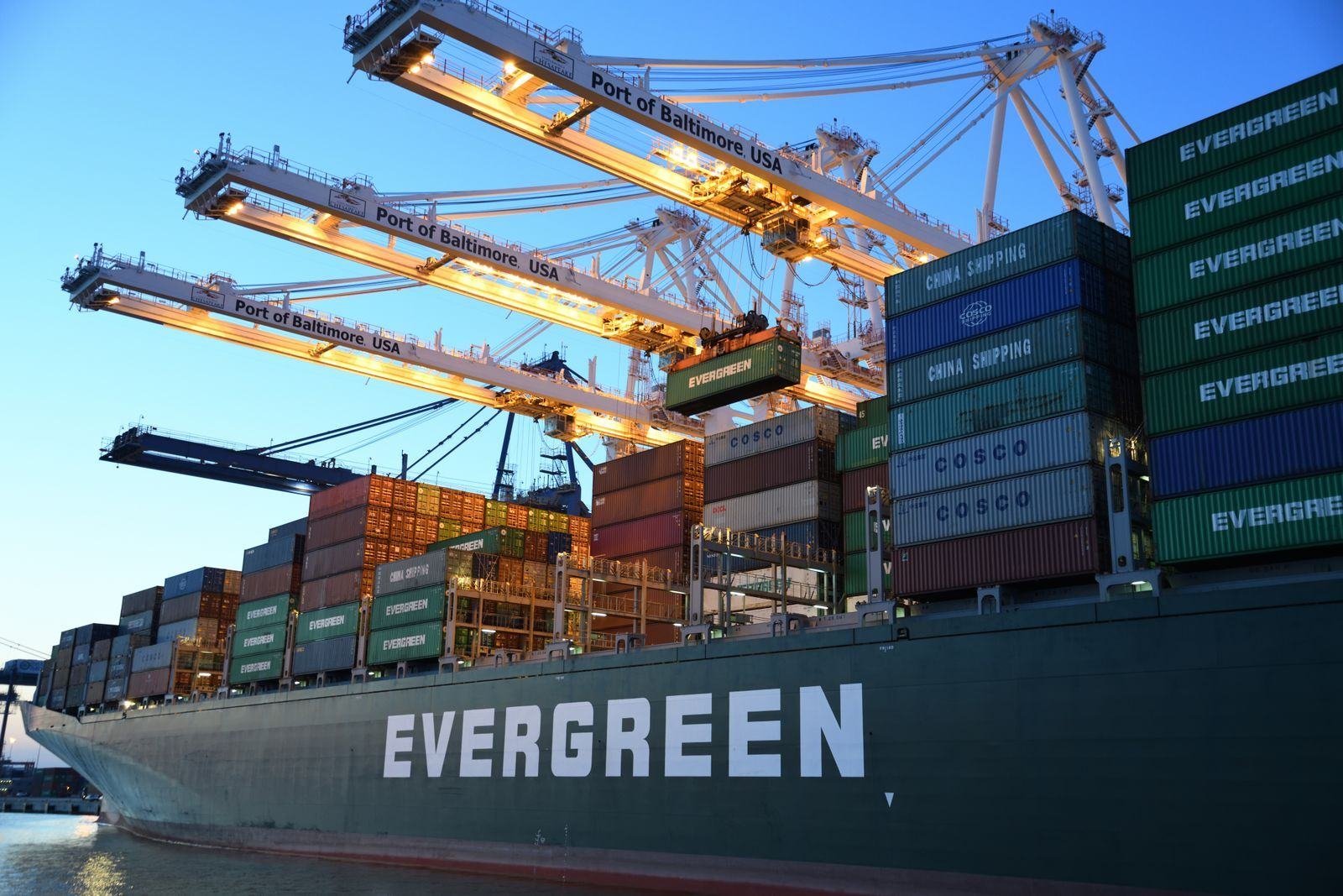 Cranes loading a container ship
